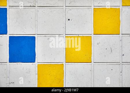 Tiled wall (white, yellow & blue) Stock Photo