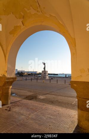 Angel Statue of Victory at sunset framed in an arch. Stock Photo