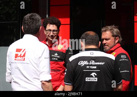 Barcelona, Circuit de Barcelona Catalunya, Spain. 22nd May, 2022. F1 Grand Prix of Spain, Race Day; Scuderia Ferrari Team Principal, Mattia Binotto chats with Gino Rosato, Haas F1 Team principal, Guenther Steiner and Alfa Romeo F1 Team Orlen Team Principal, Frederic Vasseur Credit: Action Plus Sports/Alamy Live News Stock Photo