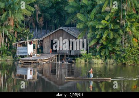 Amazonian family in front of their stilt home in the Mapuá River, Marajó region, Pará, Amazon, Brazil. May, 2004. Stock Photo