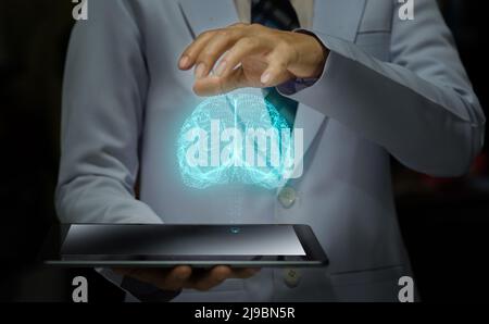woman doctor holding smart device with futuristic hologram, futuristic brain model and modern medical concept Stock Photo