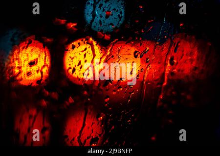 bokeh lights of car traffic at rainy night , abstract background Stock Photo