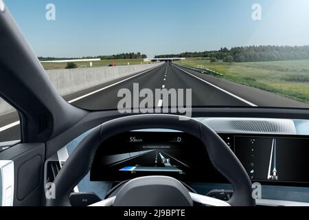 Autonomous car on a road. Inside view.  Stock Photo