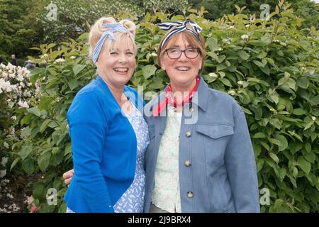 Haworth, West Yorkshire, UK. 22nd May, 2022. Two women in period costume at Haworth 1940s weekend. Haworth 1940s weekend is an annual event celebrating the 1940s. Credit: Paul Thompson/Alamy Live News Stock Photo