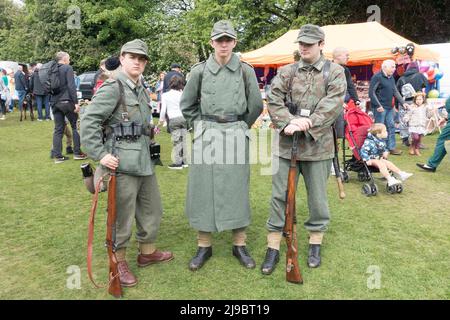 Haworth, West Yorkshire, UK. 22nd May, 2022. Three men dressed in German Army uniforms at Haworth 1940s weekend. Haworth 1940s weekend is an annual event celebrating the 1940s. Credit: Paul Thompson/Alamy Live News Stock Photo