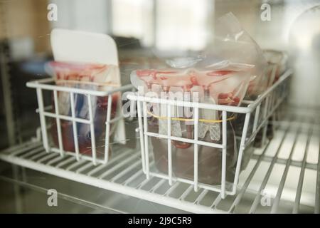 Close up of blood bags supply in medical fridge at clinic, copy space Stock Photo