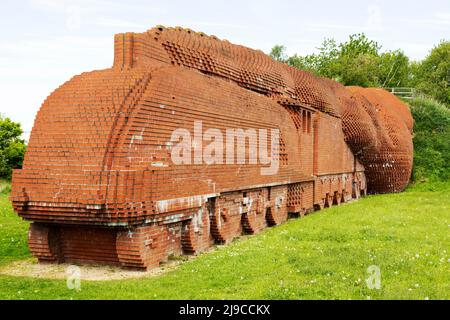 Darlington Brick Train in Darlington, County Durham, England. The brickwork sculpture depicts a speeding Mallard locomotive. Stock Photo