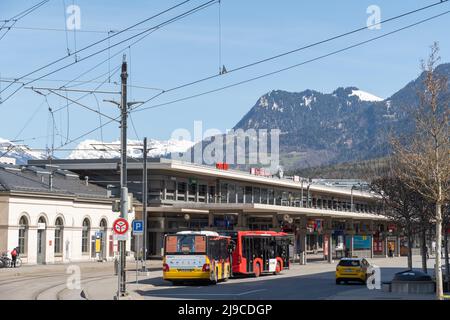 Chur, Switzerland, April 11, 2022 Buses in front of the main train station in the city center Stock Photo