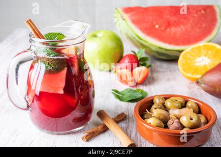 https://l450v.alamy.com/450v/2j9ce7p/jar-with-sangria-typical-spanish-drink-along-with-some-of-the-fruits-used-for-its-preparation-2j9ce7p.jpg
