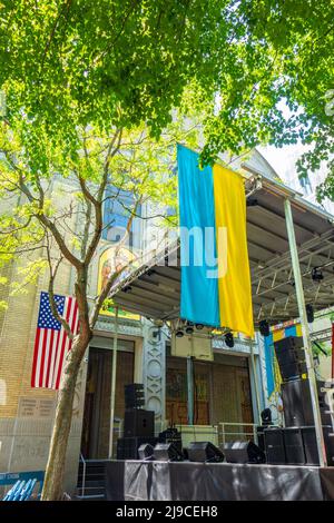 American flag and Ukrainian flag hanging on bandstand at St. George Ukrainian Greek Catholic Church Festival in the East Village in 2022 Stock Photo