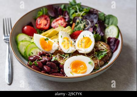 Medium boiled eggs with sasld, healthy breakfast Stock Photo