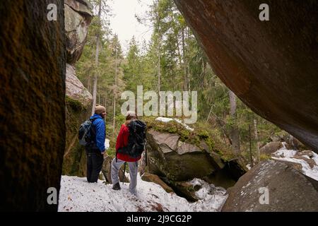 Happy tourists enjoying their adventure in mountains Stock Photo