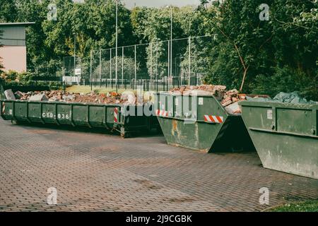 in large containers there is the waste from a house demolition Stock Photo