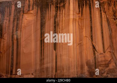 Desert Varnish Makes A Natural Bar Code On A Sandstone Wall in Capitol Reef National Park Stock Photo