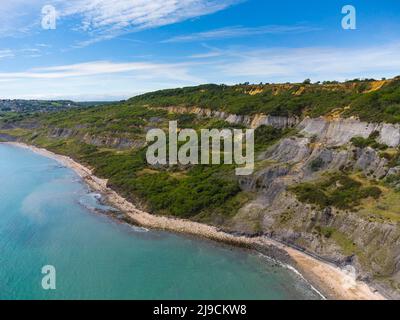 Charmouth, Dorset, UK.  22nd May 2022.  UK Weather.  View from the air of the Black Venn cliffs at Charmouth on the Jurassic Coast of Dorset on an afternoon of scorching hot sunshine. Picture Credit: Graham Hunt/Alamy Live News Stock Photo