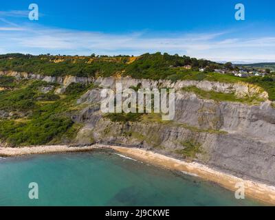 Charmouth, Dorset, UK.  22nd May 2022.  UK Weather.  View from the air of the Black Venn cliffs at Charmouth on the Jurassic Coast of Dorset on an afternoon of scorching hot sunshine. Picture Credit: Graham Hunt/Alamy Live News Stock Photo