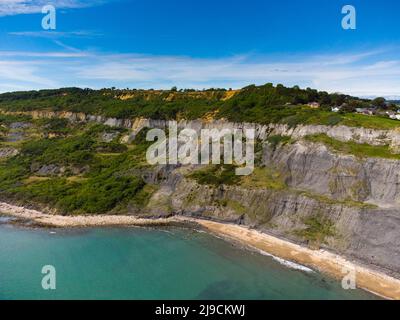 Charmouth, Dorset, UK.  22nd May 2022.  UK Weather.  View from the air of the Black Venn cliffs at Charmouth on the Jurassic Coast of Dorset on an afternoon of scorching hot sunshine. Picture Credit: Graham Hunt/Alamy Live News Stock Photo