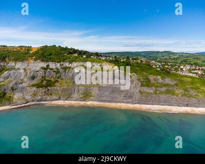 Charmouth, Dorset, UK.  22nd May 2022.  UK Weather.  View from the air of the Black Venn cliffs at Charmouth on the Jurassic Coast of Dorset on an afternoon of scorching hot sunshine. Picture Credit: Graham Hunt/Alamy Live News Stock Photo