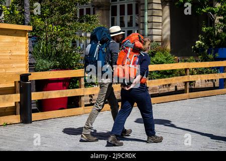 Paris, France - May 21, 2022 Tourists walking in the streets of Paris near the train station during the coronavirus outbreak hitting France, wearing a Stock Photo
