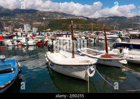 Budva, Montenegro - August 26, 2021: Boats and yachts anchored at harbour in the town of Budva, Montenegro. Luxury travel destination with beatuiful b Stock Photo