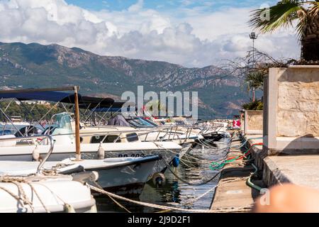 Budva, Montenegro - August 26, 2021: Boats and yachts anchored at harbour in the town of Budva, Montenegro. Luxury travel destination with beatuiful b Stock Photo