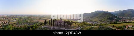 Panoramic Aerial footage view from the drone of a ancient fortress built on a green hill, Gussago, Bergamo, Italy Stock Photo