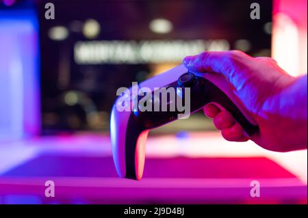Close-up. Joystick in the hand of a gamer. Video games, new modern dartless technologies, communications, online games with friends, cyberspace, cyber Stock Photo
