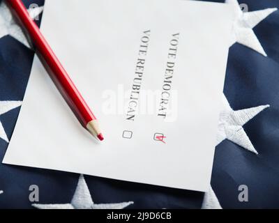 On the American flag lies a ballot paper and a red pencil. Close-up. Elections, debates, election campaigning, right and freedom of choice, independen Stock Photo