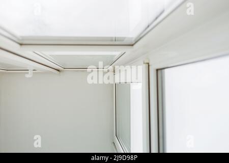 White metal-plastic windows of balcony in apartment. renovation Stock Photo