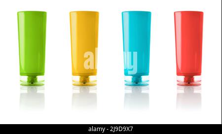 Set of hair conditioner colorful bottles isolated on a white background. Multicolored body cream containers. Upside down сosmetic tubes for beauty pro Stock Photo