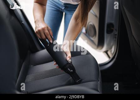 Man Hoovering Seat Of Car During Car Cleaning Stock Photo - Download Image  Now - Car, Cleaning, Car Detailing - iStock
