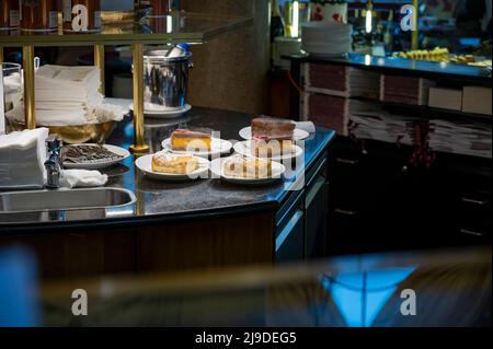 Austrian desserts, different types of chocolate and fruit cakes on display in cafe in Vienna. Stock Photo