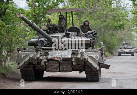 Service members of pro-Russian troops drive a tank during Ukraine-Russia conflict in the Donetsk Region, Ukraine May 22, 2022. REUTERS/Alexander Ermochenko