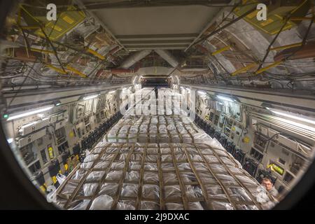 Ramstein Air Base, Germany. 22nd May, 2022. A C-17 Globemaster III assigned to Joint Base Pearl Harbor-Hickam, Hawaii, is loaded with pallets of infant formula at Ramstein Air Base, Germany, on Sunday, May 22, 2022. Hundreds of boxes of infant formula arrived from Switzerland before being loaded on a C-17 for transport as part of Operation Fly Formula, an operation to quickly import infant formula to the United States that meets U.S. health and safety standards. Photo by Staff Sgt. Jacob Wongwai/U.S. Air Force/UPI Credit: UPI/Alamy Live News Stock Photo