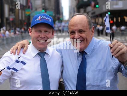 New York, New York - May 22,  2022 :  Rudy Giuliani and son Andrew Giuliani walking in New York City Israel Parade on 5th Ave . Stock Photo