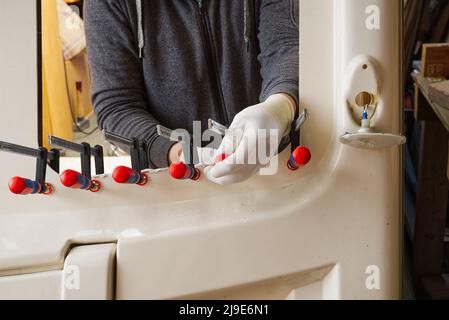 Restoring caravan after a leak from window. Rotten frame replacement Stock Photo