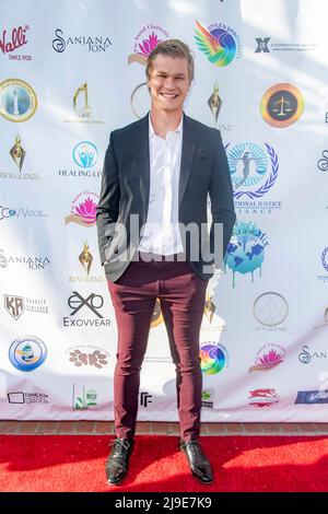 Malibu, California, USA. 21st May, 2022. Austin Aaron attends The Launch of the Justice ForOM Summit series and Ecovvear Fashion Show at Marwah Estate, Malibu, CA on May 21, 2022 Credit: Eugene Powers/Alamy Live News Stock Photo