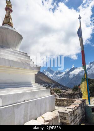 Ama Dablam (6856m) framed by the shrine to Mingma Norbu Sherpa at Khumjung. Khumbu.. Stock Photo