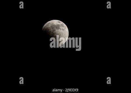Moon and stars in the sky during the total moon eclipse May 15, 2022 Stock Photo