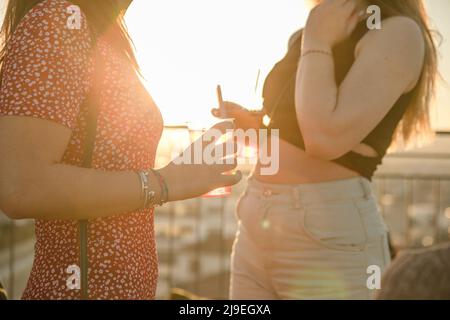 Galentines day. Slumber party. Summer Picnic Party Ideas, Outdoor Gathering with friends. Young women girl friends drinking wine, laughing, having fun Stock Photo