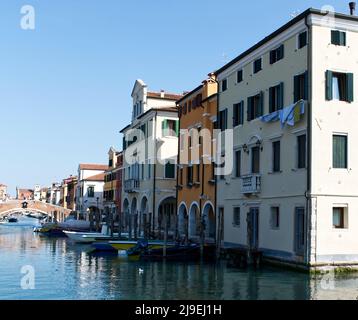 Chioggia - Venice, Italy - March 20, 2022: Canals and bridges of Chioggia. This small town is known as The Little Venice of Italy. Stock Photo