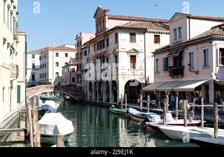 Chioggia - Venice, Italy - March 20, 2022: Canals and bridges of Chioggia. This small town is known as The Little Venice of Italy. Stock Photo