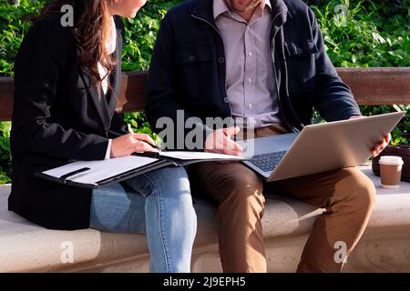 unrecognizable business partners working outdoors Stock Photo