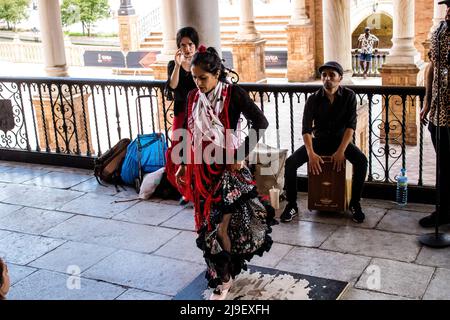 Seville, Spain - May 21, 2022 Flamenco dancers performing in the streets of Seville during the coronavirus outbreak hitting Spain Stock Photo