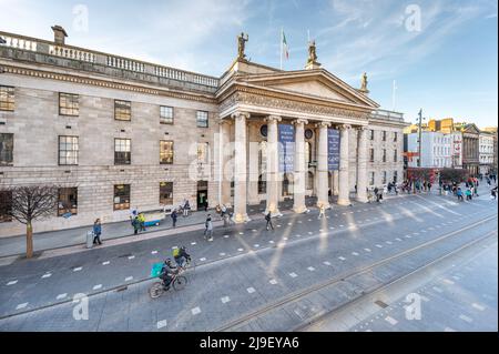 Luas tram passes in front of the GPO and Dublin Spire on a busy O'Connell Street, Dublin, Ireland Stock Photo