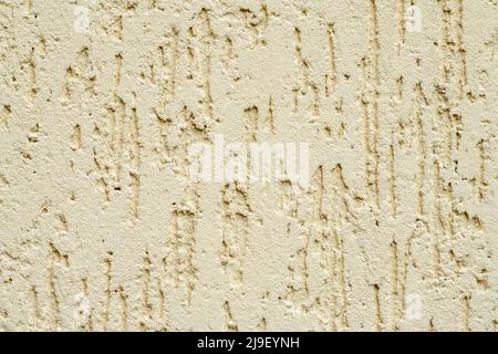 Beige plastered wall texture. Seamless surface and abstract solid background. Pale painted wall built structure. Stock Photo
