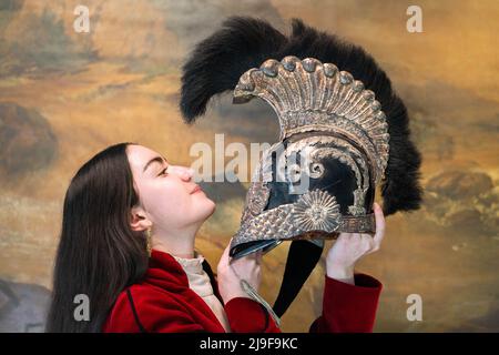 London UK, 23 May 2022. Bonhams art handler holds a rare French 1814 Model Helmet For The Royal Bodyguard Of Louis XVIII, Estimate: £4,000 - 5,000 at the preview of Arms and Antique Armour sale at Bonhams Knightsbridge. The sale takes place on 25 May 2022. Credit. amer ghazzal/Alamy Live News Stock Photo