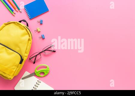 Students supplies in yellow school backpack. Back to school concept Stock Photo