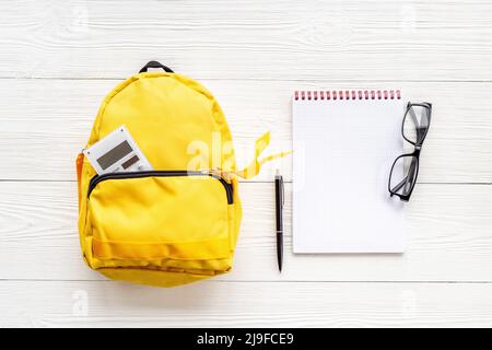Flat lay of school backpack with school items and student accessories, top view Stock Photo