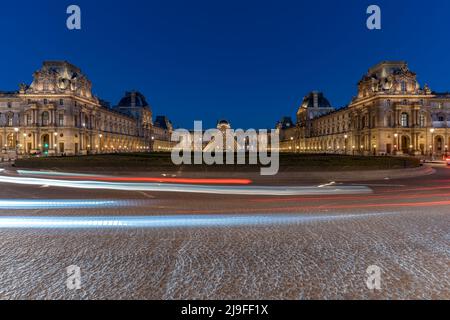 PARIS, FRANCE - JULY 14 2022: The Louvre at night is one of the world's largest museums  Stock Photo